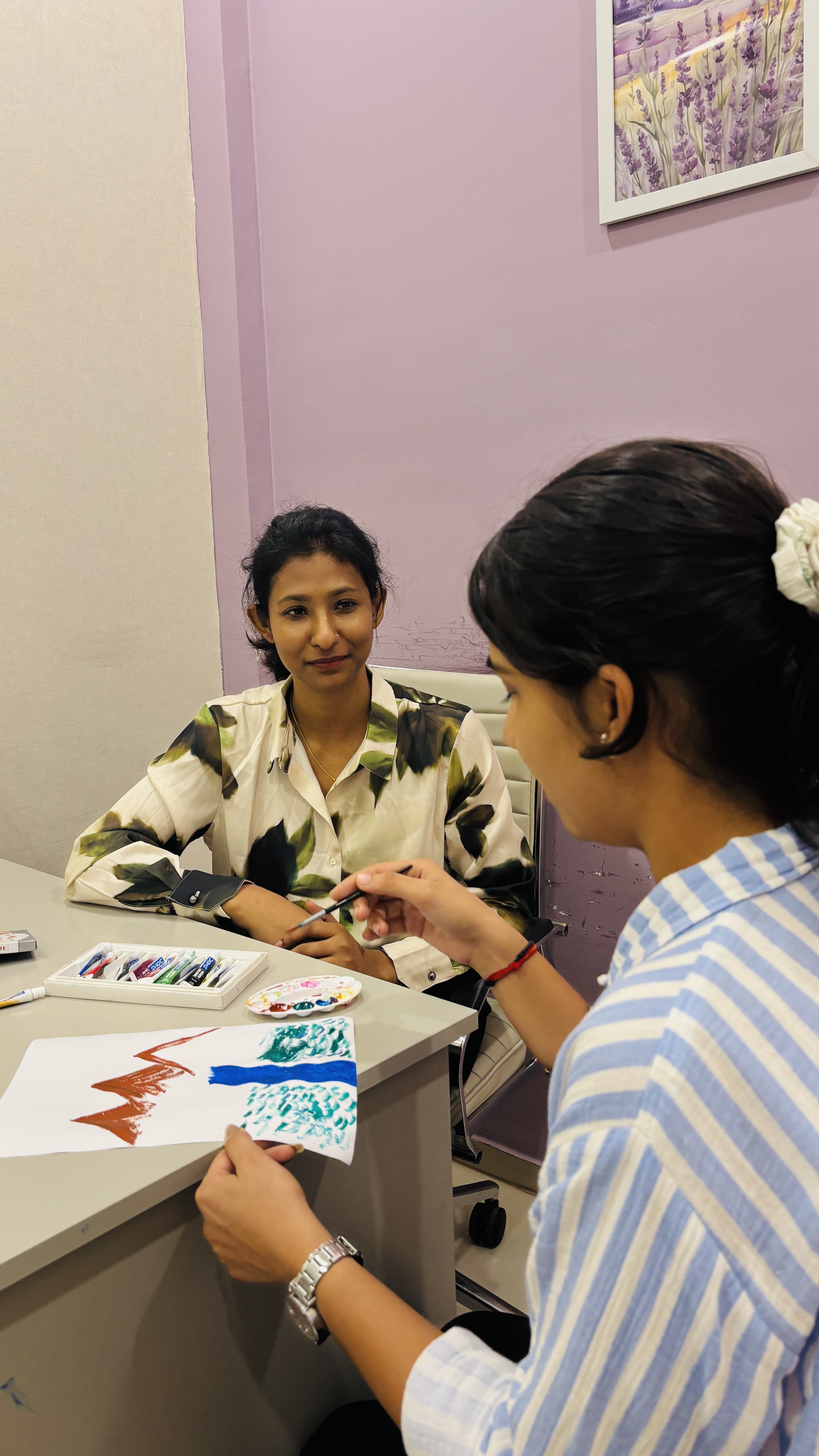 An art therapy session at Renaissance with painting and creative expression.